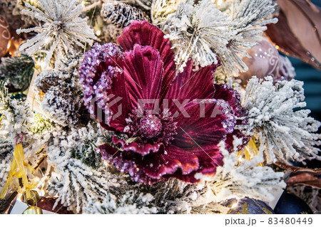 decorations of flowers and garlands on the Christmas tree decorations of flowers and garlands on the Christmas tree 83480449