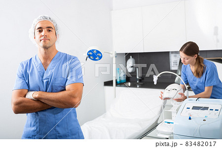 Confident professional cosmetologist in clinic of aesthetic medicine 83482017