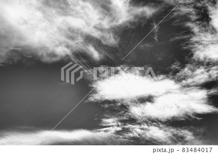 Cloudscape background texture of black and white dramatic monochrome cirrus and cumulus clouds 83484017