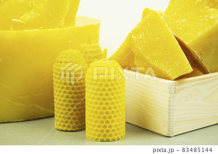 large pieces of natural beeswax, close-up, raw materials for candles. 83485144
