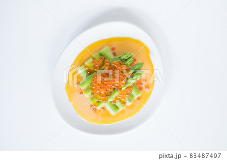 mini asparagus with sauce and red caviar on white plate, isolated on white, close up, healthy food, healthy lifestyle, picture for the menu mini asparagus with sauce and red caviar on white plate, isolated on white, close up, healthy food, healthy lifestyle, picture for the menu 83487497