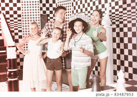 Parents with their children are satisfied after visit of escape room Parents with their children are satisfied after visit of escape room 83487953
