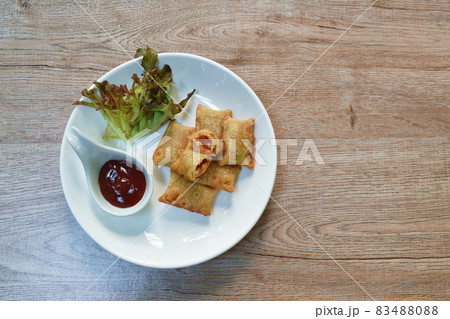 mini pie stuffed chicken and cheese dipping ketchup with vegetable salad on plate 83488088