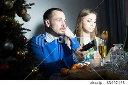Bored couple celebrating Christmas 83492128