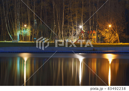 Long exposure photography of alley in the Mocow public park, Kids' play ground on the river bank. Beautiful view. Leisure and lifestyle concept. Long exposure photography of alley in the Mocow public park, Kids' play ground on the river bank. Beautiful view. Leisure and lifestyle concept. 83492238