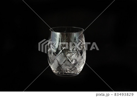 Vintage empty crystal glass on the black background. 83493829