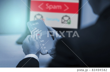 Email concept with laptop spam and virus computer monitor internet security concept, businessman reading electronic mail with a laptop. Spam, junk and e-marketing on screen, Spam Email Pop-up Warning. 83494582