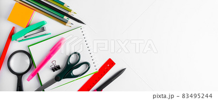 A set of office supplies on a white background. Back to school concept. Place for text. Banner format 83495244