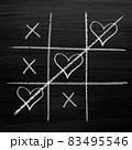 Tic tac toe game with chalk hearts, XO noughts and crosses Valentine's Day style 83495546