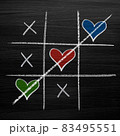 Tic tac toe game with chalk hearts, XO noughts and crosses Valentine's Day style 83495551