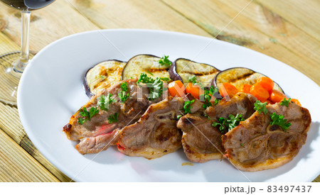 Barbecued lamb chops with aubergine Barbecued lamb chops with aubergine 83497437