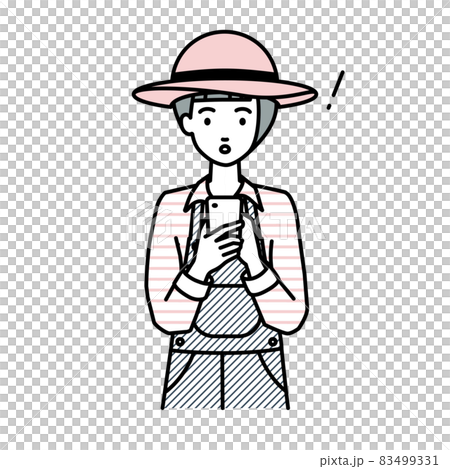 立ってスマートフォンを操作して何かに気づいて驚いた農家の女性 83499331