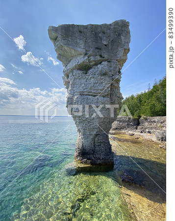 Pillar rock rise from the waters of Georgian Bay on Flowerpot island in Fathom Five National Marine Park, Lake Huron, Canada Pillar rock rise from the waters of Georgian Bay on Flowerpot island in Fathom Five National Marine Park, Lake Huron, Canada 83499390