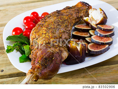 Gigot baked in oven with honey Gigot baked in oven with honey 83502906