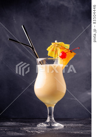 Traditional caribbean cocktail pina colada in a glass. Traditional caribbean cocktail pina colada in a glass. 83504446