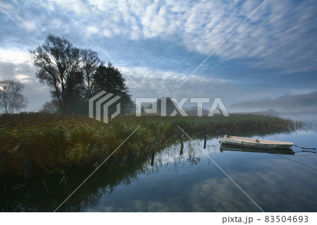 Lake and boat in Denmark in Autumn Lake and boat in Denmark in Autumn 83504693