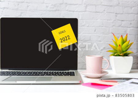 Goals and Budget New Year 2022. Healthy snack with working in office. Goals and Budget New Year 2022. Healthy snack with working in office. 83505803