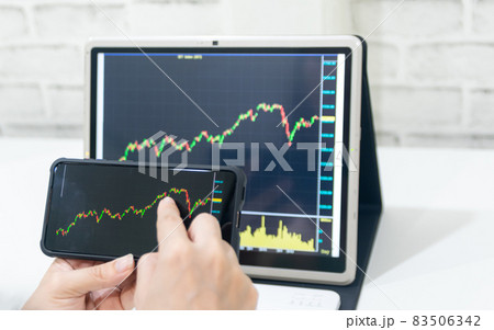 A business examines the financial graph of sales growth on the computer A business examines the financial graph of sales growth on the computer 83506342