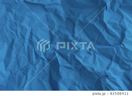 Blue crumpled wrinkled paper pattern surface texture background. Blue crumpled wrinkled paper pattern surface texture background. 83506411