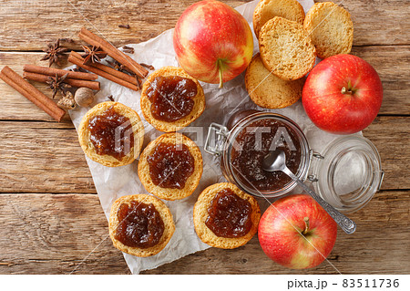 Tasty sweet apple butter and toasts style rustic selective focus closeup. Horizontal top view 83511736