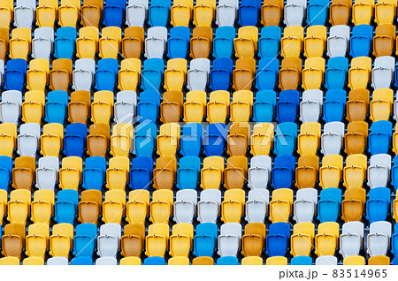 Closeup of yellow and blue seats on stadium Closeup of yellow and blue seats on stadium 83514965