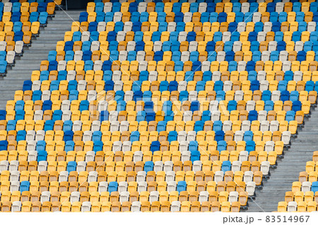 Closeup of yellow and blue seats on stadium Closeup of yellow and blue seats on stadium 83514967