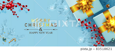 Christmas light blue holiday card, composition with a gift box with a gold bow, red berry branches, gold tinsel. Christmas light blue holiday card, composition with a gift box with a gold bow, red berry branches, gold tinsel. 83518621
