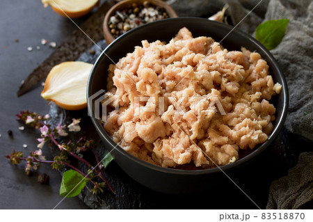 Minced meat and ingredients for cooking minced meat in a bowl on a slate. Minced meat and ingredients for cooking minced meat in a bowl on a slate. 83518870