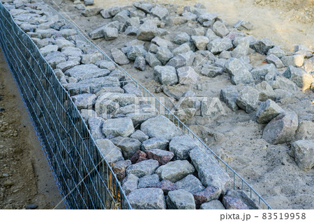 unfinished gabion fence wall construction from steel mesh with stones unfinished gabion fence wall construction from steel mesh with stones 83519958