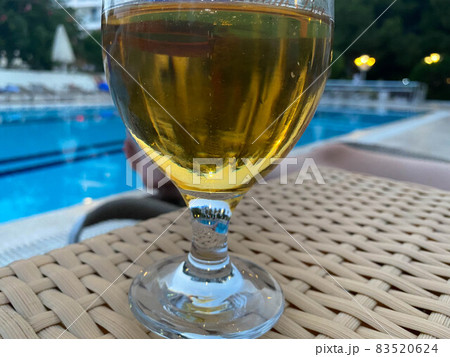 Glass Of Cold Beer On Pool Board In Hot Summer Day Glass Of Cold Beer On Pool Board In Hot Summer Day 83520624