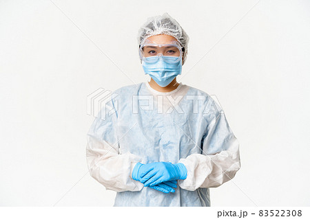 Portrait of asian doctor or nurse in ppe, personal protective equipment, standing in confident, ready pose, white background Portrait of asian doctor or nurse in ppe, personal protective equipment, standing in confident, ready pose, white background 83522308