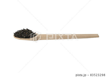 yunnan black tea on wooden spoon isolated on white background. 83523298