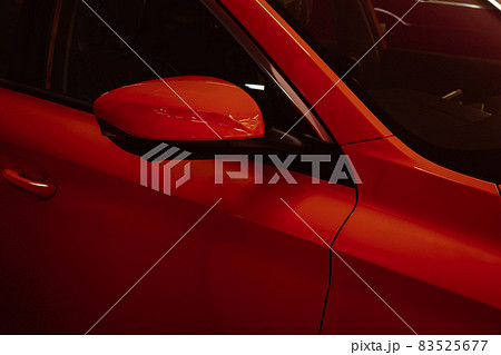 Close-up side mirrors of red car for parking safety. Close-up side mirrors of red car for parking safety. 83525677