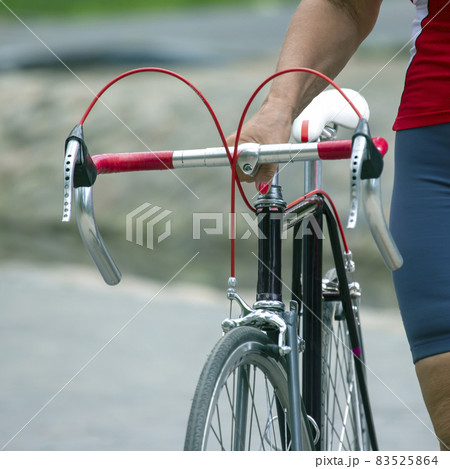 sports bike in the hands of a woman. recreation and sports lifestyle 83525864