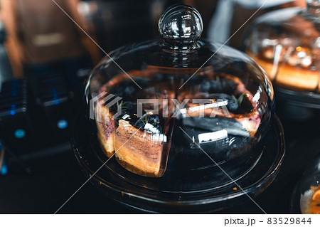 Fruit cakes in a glass cabinet at a coffee shop Fruit cakes in a glass cabinet at a coffee shop 83529844