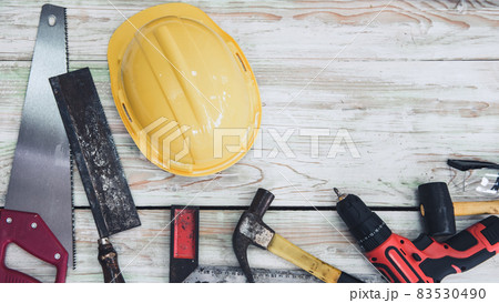 Home Maintenance and DIY Tool Work, Safety Equipments and Hand Tools for Home DIY Wooden Work on Table Wood Background. Carpentry Utility Tools for Building Repair and Wooden Hand Craft 83530490