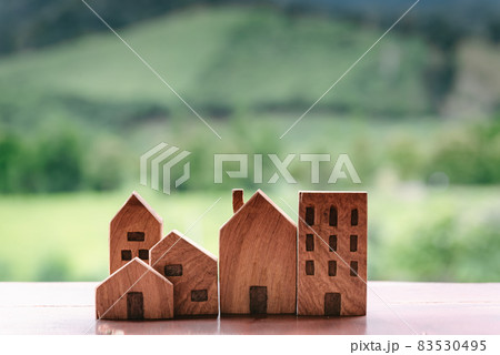 Wooden House Against Nature Hill Background, Housing Market and Real Estate Development Concept. Business Home Insurance and Property Investment for Future Concepts. House Equity Loan 83530495