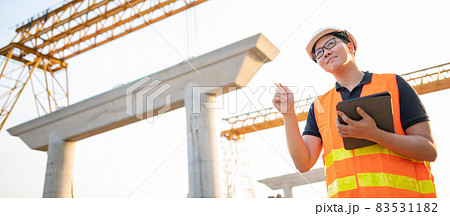 Asian worker using digital tablet at construction site Asian worker using digital tablet at construction site 83531182