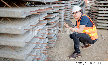 Asian worker using digital tablet at construction site 83531192