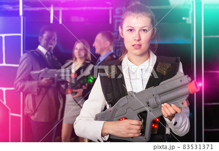 Fine female and her colleagues in laser tag room 83531371