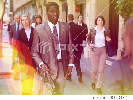 African businessman walking on street 83531372