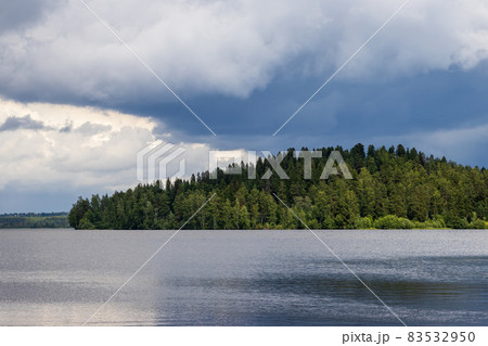 Beautiful summer landscape with a forest lake. Beautiful summer landscape with a forest lake. 83532950