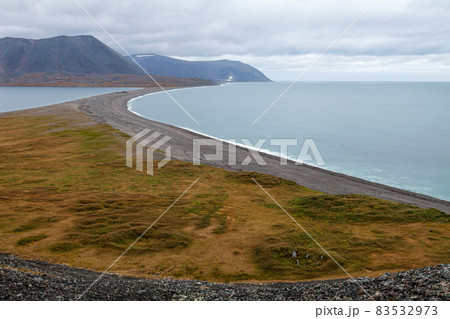 Top view of the tundra-covered ruins of the ancient Chukchi village of Avan on the shores of the Bering Sea. Top view of the tundra-covered ruins of the ancient Chukchi village of Avan on the shores of the Bering Sea. 83532973