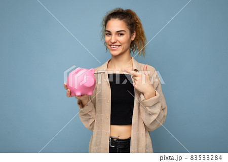 Portrait photo of happy positive smiling young beautiful attractive brunette curly woman with Portrait photo of happy positive smiling young beautiful attractive brunette curly woman with 83533284