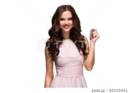 Sexy curly hair brunette posing with chips in her hands, poker concept isolation on white background Sexy curly hair brunette posing with chips in her hands, poker concept isolation on white background 83535041