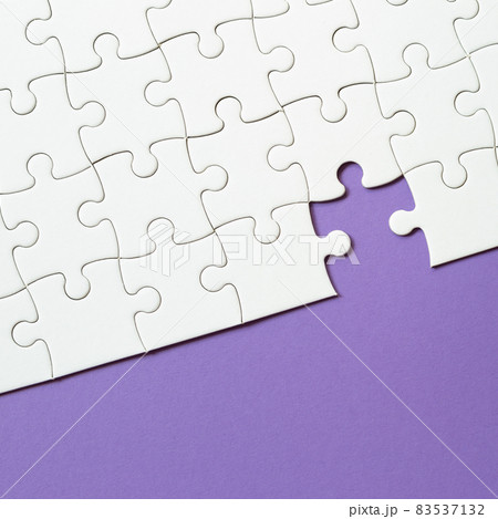 Set of white puzzle pieces and last one piece 83537132