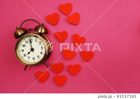 Vintage Alarm Clock and Red Heart with space copy on Pink Background Vintage Alarm Clock and Red Heart with space copy on Pink Background 83537583