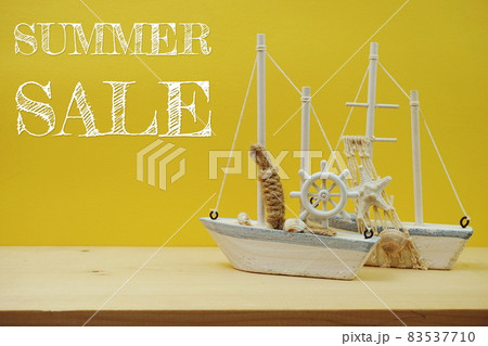 Nautical background with Sailboat Model with summer sale on yellow background Nautical background with Sailboat Model with summer sale on yellow background 83537710