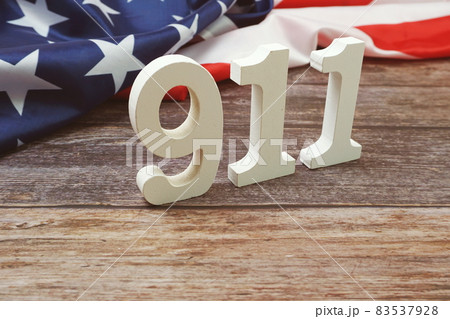 911 alphabet letters with USA Flag on wooden background 83537928