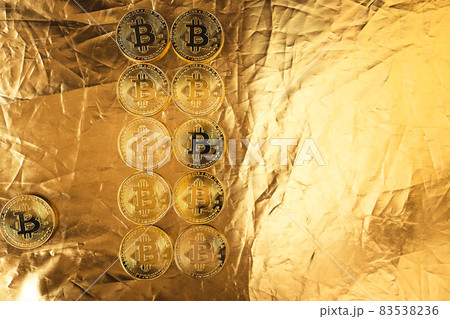 gold bitcoin on gold background 83538236